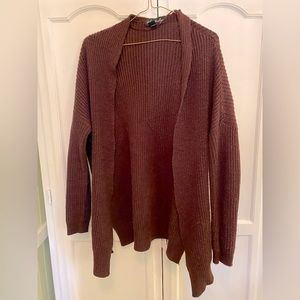 Red knit cardigan with side slits